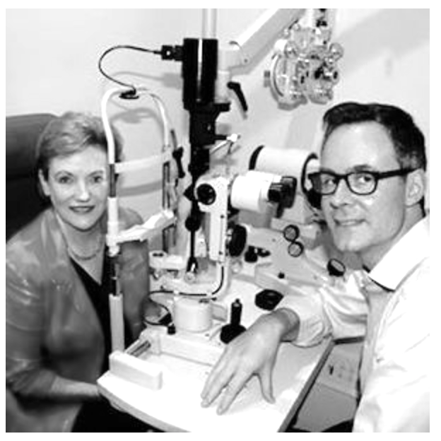 Dean Samarkovski Optometrist and MP Jane Prentice sitting at the slit lamp whilst having an eye examination