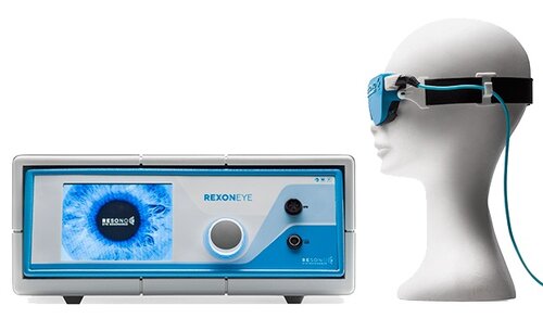 Rexon quantum molecular resonance machine with googles placed on manekin as used for dry eye treatment